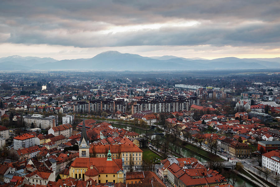 View across Ljubljana to Krim mountain and the Ljubljana Moors Photograph by Ian Middleton