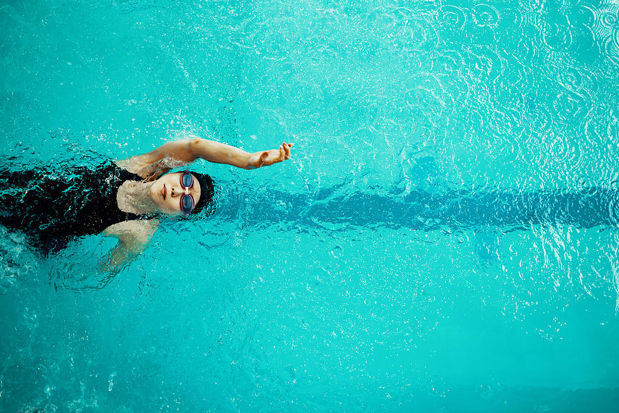 View from directly above a paraplegic woman training in a pool for competitive swimming. Photograph by Trevor Williams