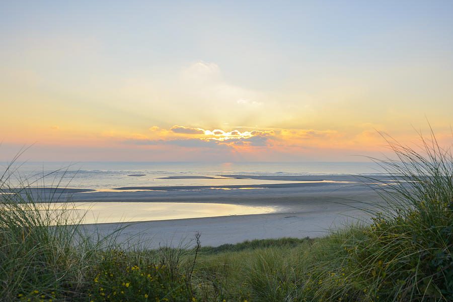 View from the dunes of a sunset at the beach Photograph by Sjoerd van der Wal