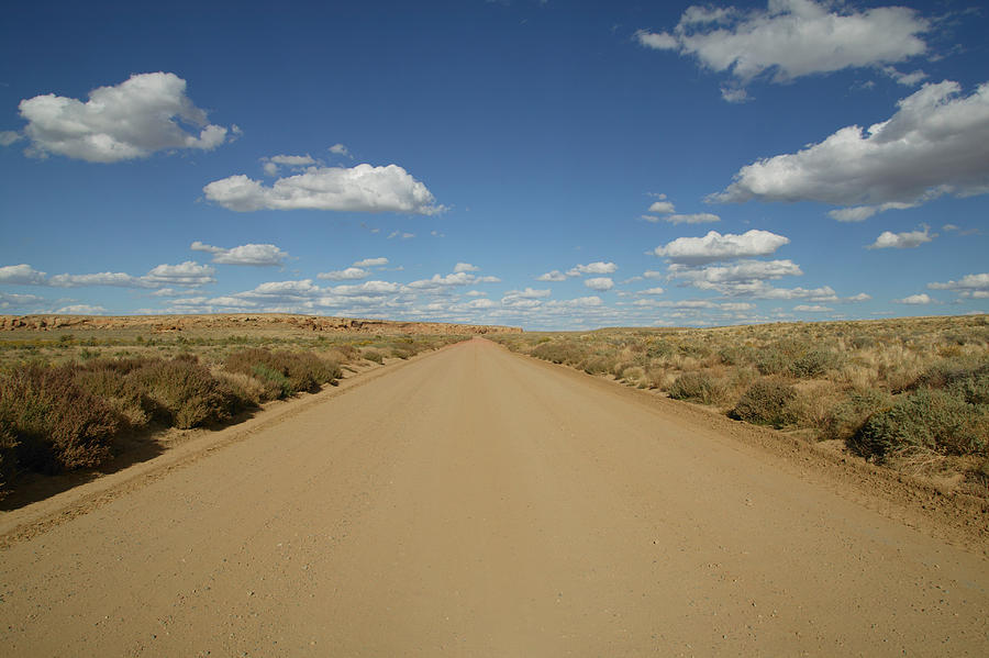 View of a dirt road near Chacon Canyon, New Mexico, USA Photograph by Denkou Images