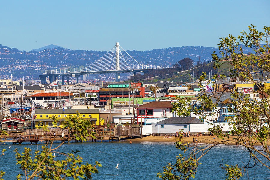 View of Bay Bridge Tower and Fishermans Wharf Photograph by Bonnie Follett