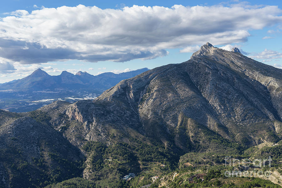 Clouds and the Sierra de Bernia mountain range Photograph by Adriana Mueller