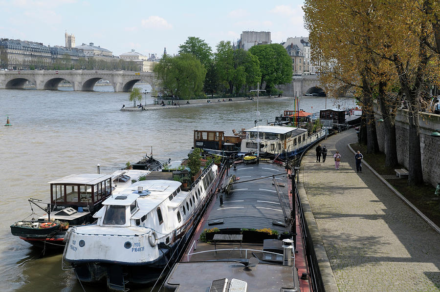 View of boats and the Place Dauphine from the Pont des Arts, Paris,Ile-de-France, France Photograph by Kevin Oke