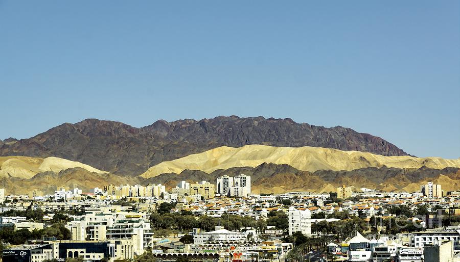 View of Eilat, Israel and Aqaba, Jordan with the Wadi Rum Mountains in the background. Photograph by William Kuta