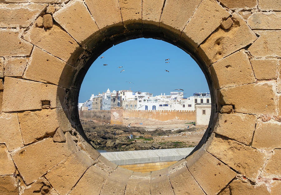 View of Essaouira through hole in wall Photograph by Mikhail Kokhanchikov