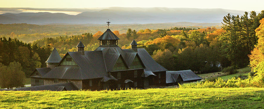 view of fall foliage with the historic farm barn roof at Shelburne Farms Photograph by Ann Moore