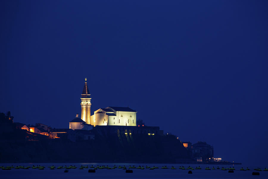 View of Saint Georges Parish Church in Piran at dusk Photograph by Ian Middleton