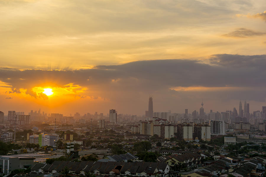 View of sunset at downtown Kuala Lumpur. Its modern skyline is dominated by the 451m tall Petronas Twin Towers, pair of of glass-and-steel-clad skyscraper. Photograph by Shaifulzamri