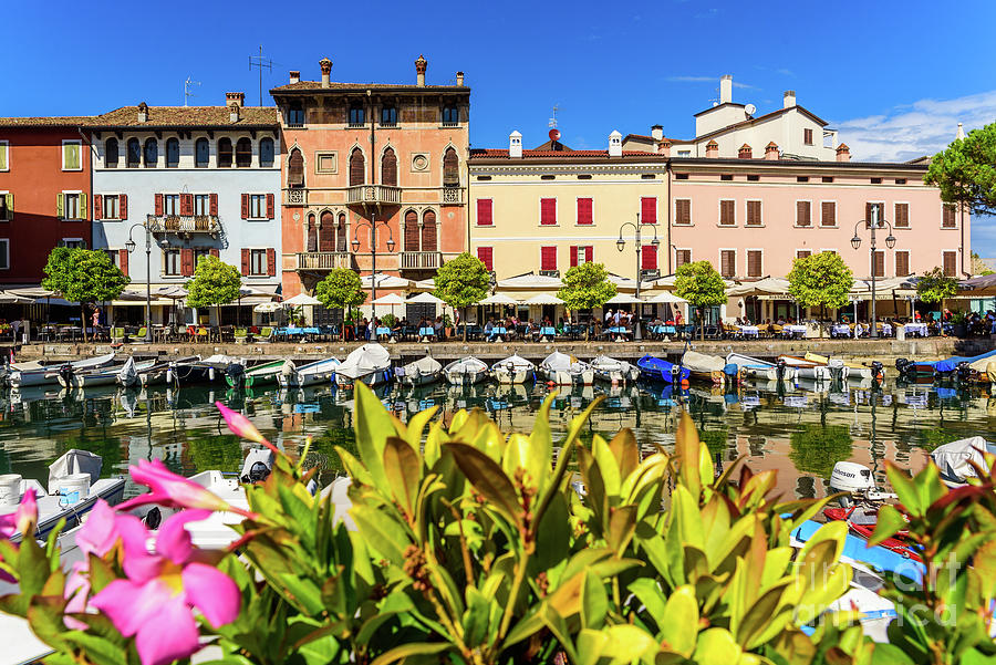 View of the small old port of Lake Garda a sunny day in Desenzano. Photograph by Joaquin Corbalan