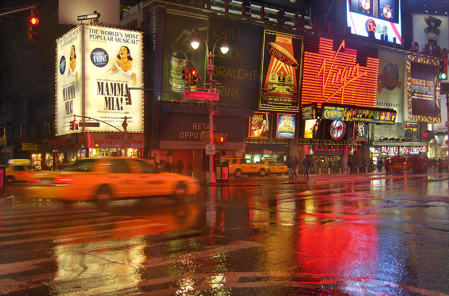 View of Times Square on rainy winter evening Photograph by Piccell