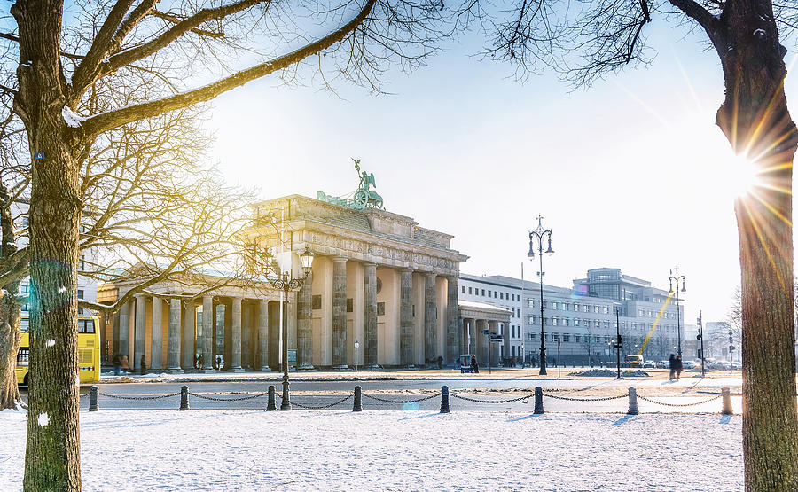 view on Berlin Brandenburger Tor with snow in morning sun Photograph by Golero