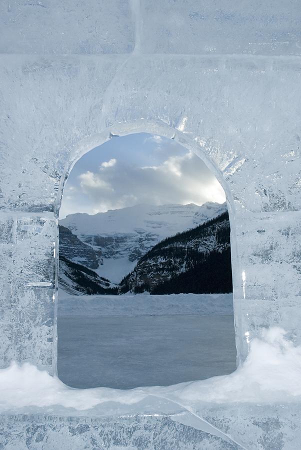 View through carved ice at lake louise Photograph by Image Source