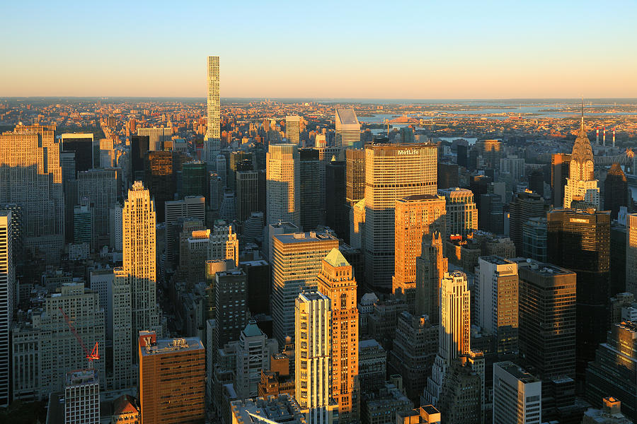 View to Midtown Manhattan and Upper Eastside at sunset Photograph by Rainer Grosskopf