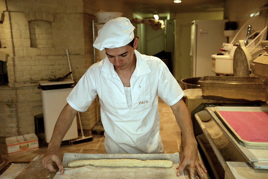 Village baker at work. Photograph by Oliver Strewe