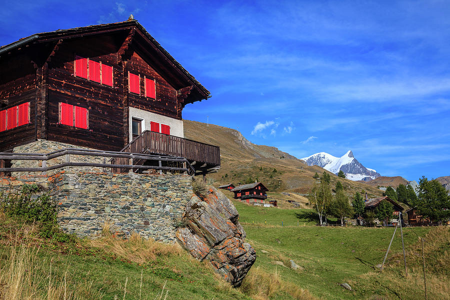 Village in Swiss Alps Photograph by Alexey Stiop