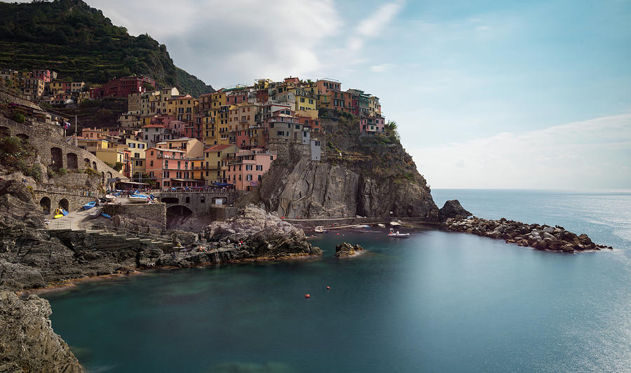 Village of Manarola with colourful houses at the edge of the cliff Riomaggiore, Cinque Terre, Liguria, Italy Photograph by Michalakis Ppalis