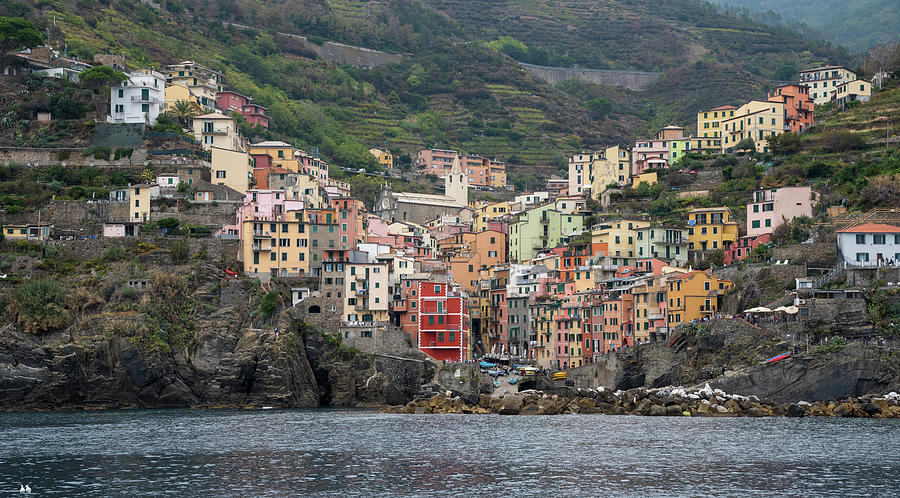 Village of Manarola with colourful houses at the edge of the cliff Riomaggiore,Cinque Terre, Liguria, Italy Photograph by Michalakis Ppalis
