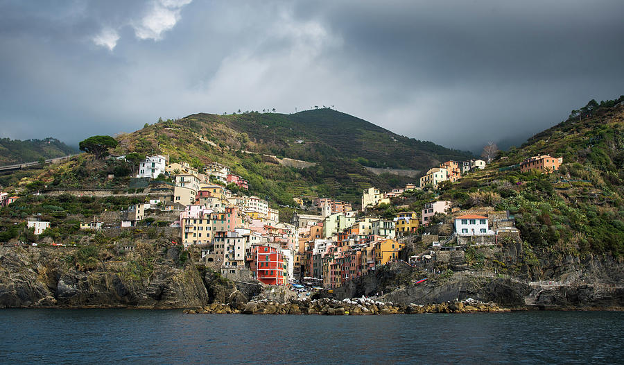 Village of Riomaggiore with colourful houses in Cinque Terre Photograph by Michalakis Ppalis