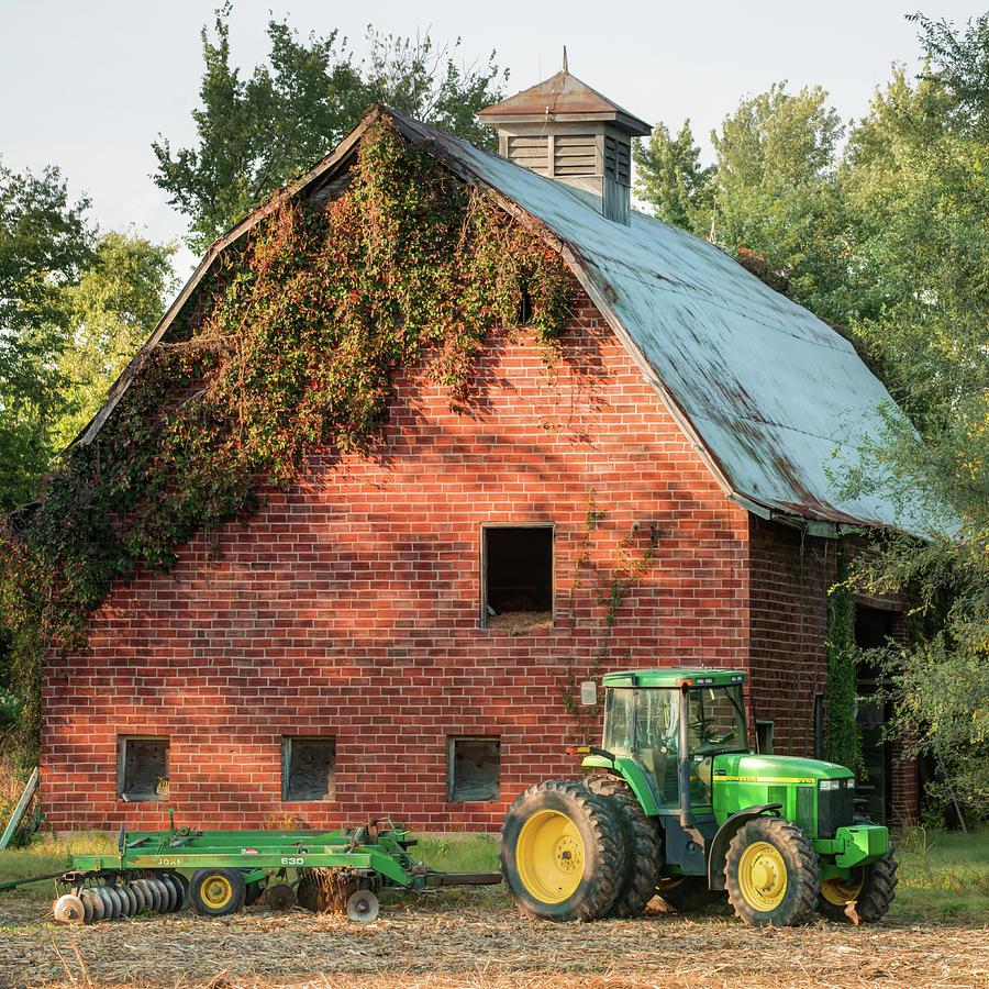 Vintage Barn and Green Farm Tractor 1x1 Photograph by Gregory Ballos