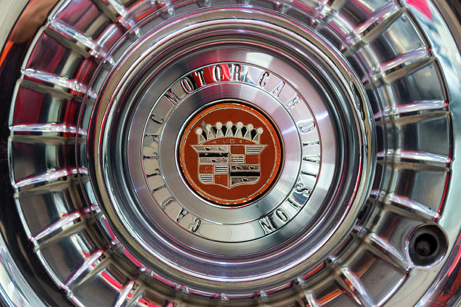 Vintage Cadillac De Ville Convertible 1967 wheel with emblem Photograph by Viktor Wallon-Hars