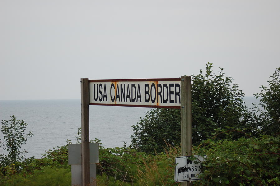 Vintage Canada United States Border Sign Photograph by James Cousineau