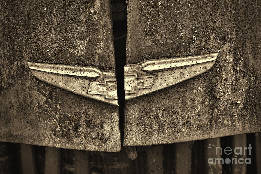 Vintage Chevy Hood Emblem sepia Photograph by Paul Ward
