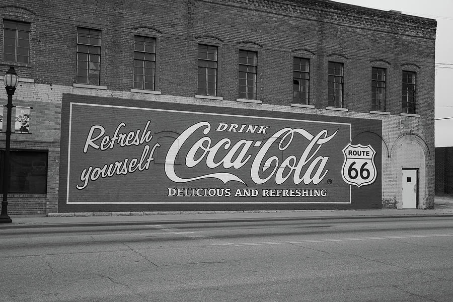 Vintage Coca Cola mural advertisement on Historic Route 66 in Galena Kansas in black and white Photograph by Eldon McGraw