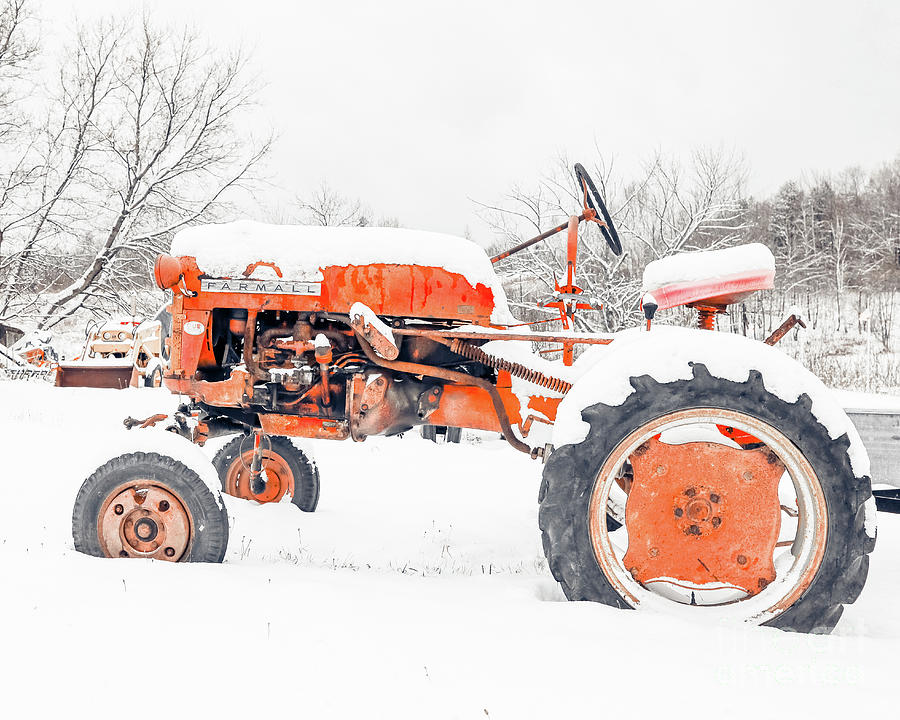 Vintage Farmall Red Tractor in Winter Snow Photograph by Edward Fielding