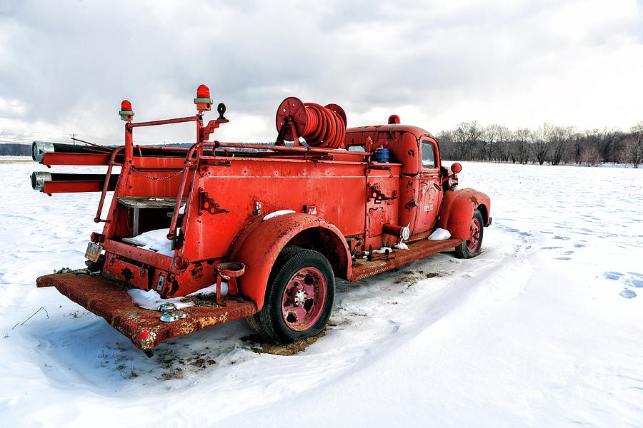 Vintage Fire Truck in the Snow Photograph by John Rizzuto
