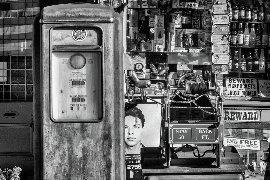 Vintage Gas Pump And Memorabilia Black and White Photograph by James Eddy