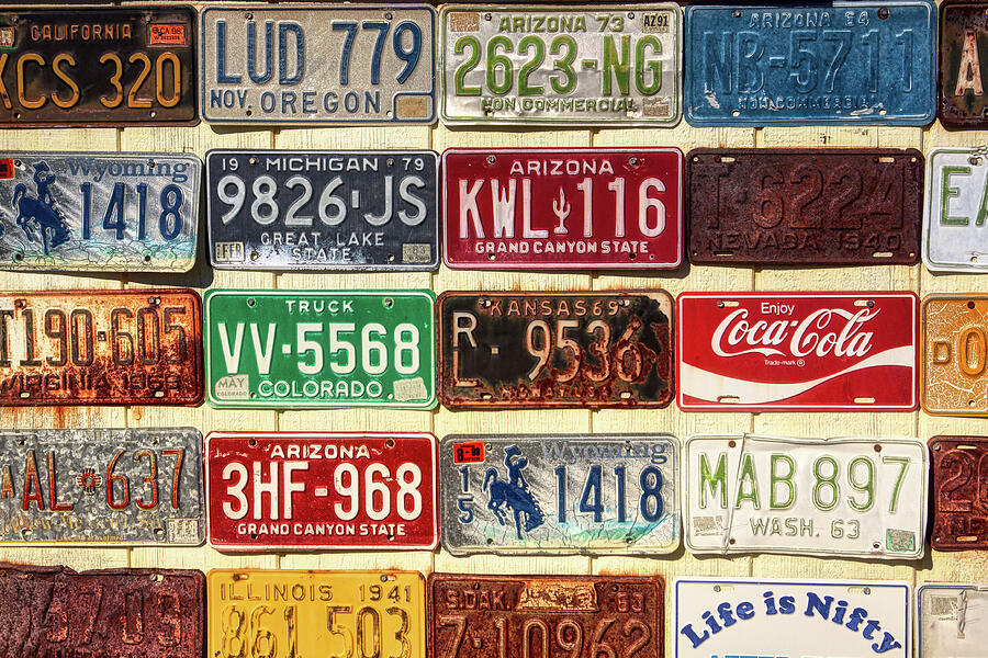 Vintage license plates display Photograph by Tatiana Travelways