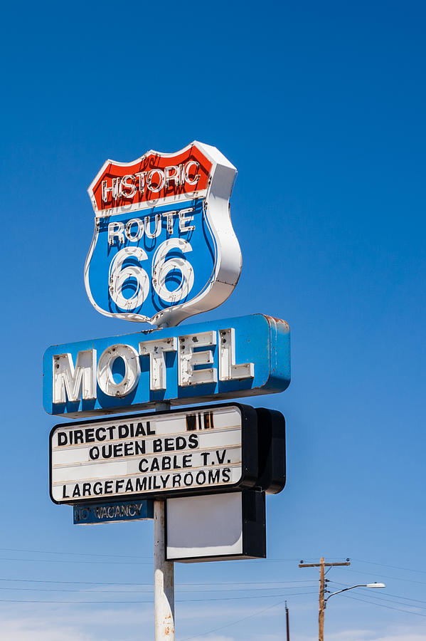Vintage motel sign along the historic Route 66 in Arizona. Photograph by Oleksandra Korobova