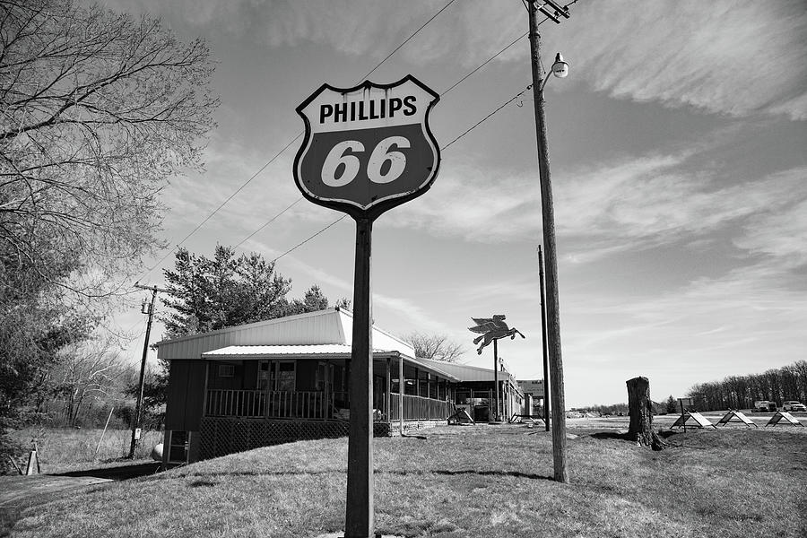 Vintage Phillips 66 sign on Historic Route 66 in black and white Photograph by Eldon McGraw