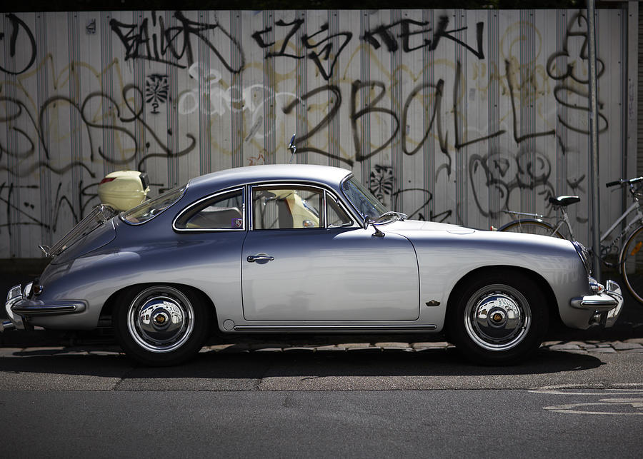 Vintage Porcshe against wall of graffiti. Photograph by James Braund