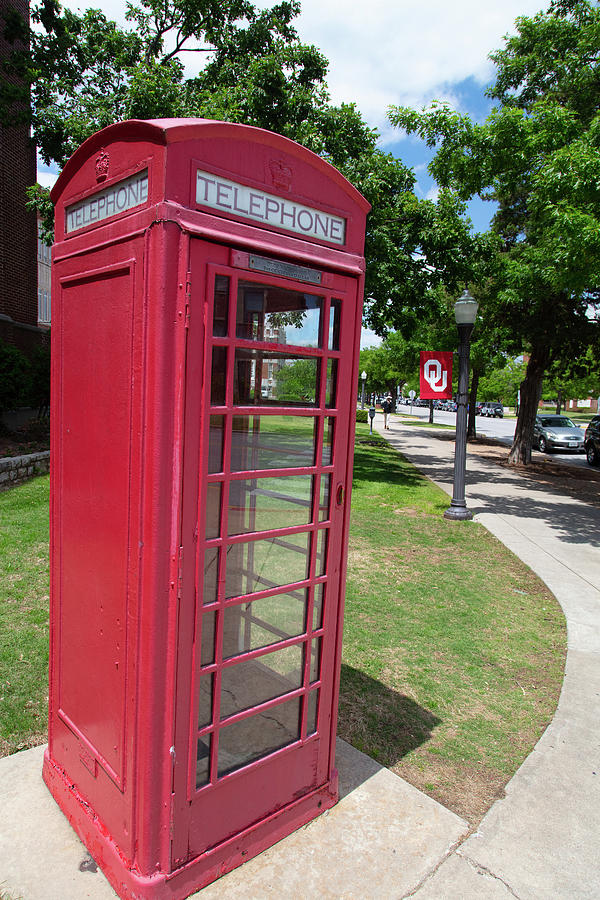Vintage red telephone booth on the campus of the University of Oklahoma Photograph by Eldon McGraw