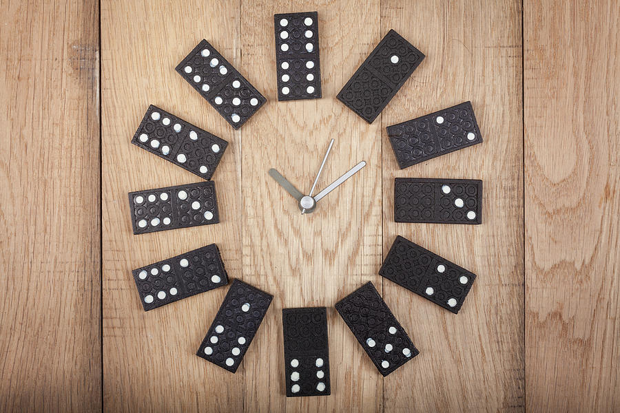 Vintage Style Clock Made Of Domino Plates On Wooden Background. Domino Clock Photograph