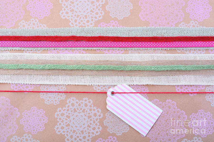 Vintage style gift wrapping holiday background.  Photograph by Milleflore Images