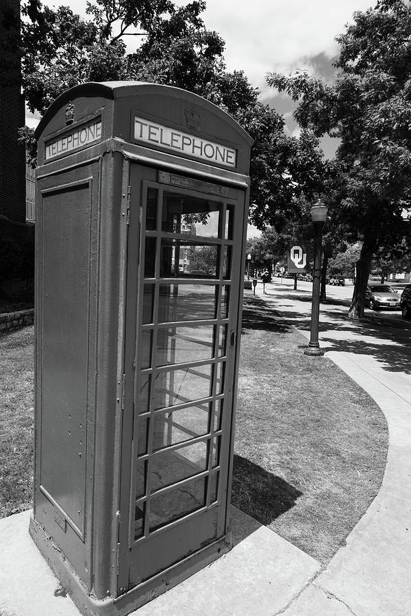 Vintage telephone booth on the campus of the University of Oklahoma in black and white Photograph by Eldon McGraw