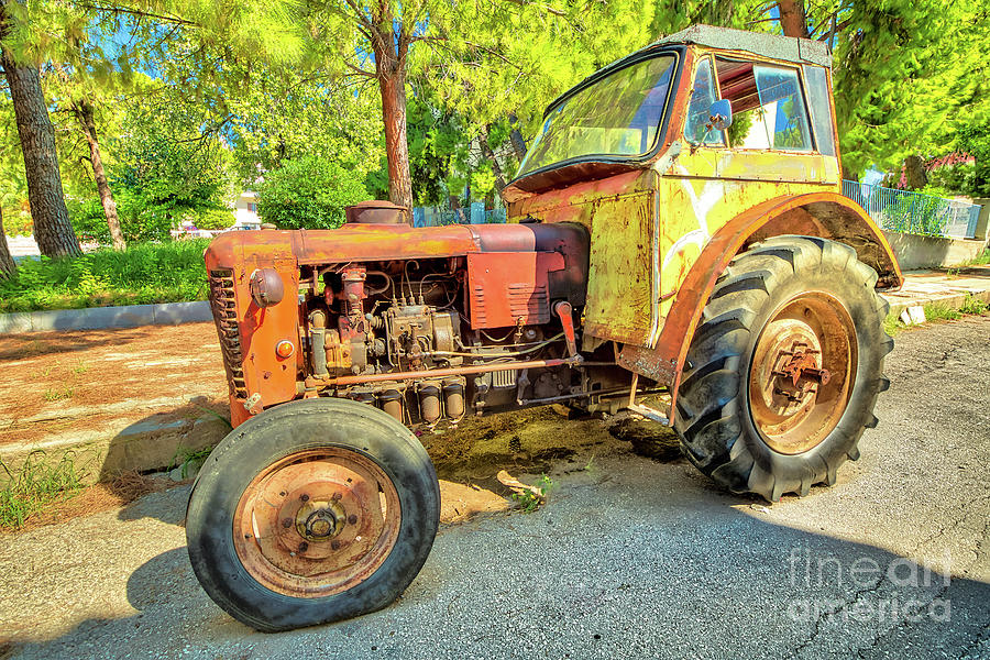 Vintage tractor abandoned Photograph by Benny Marty