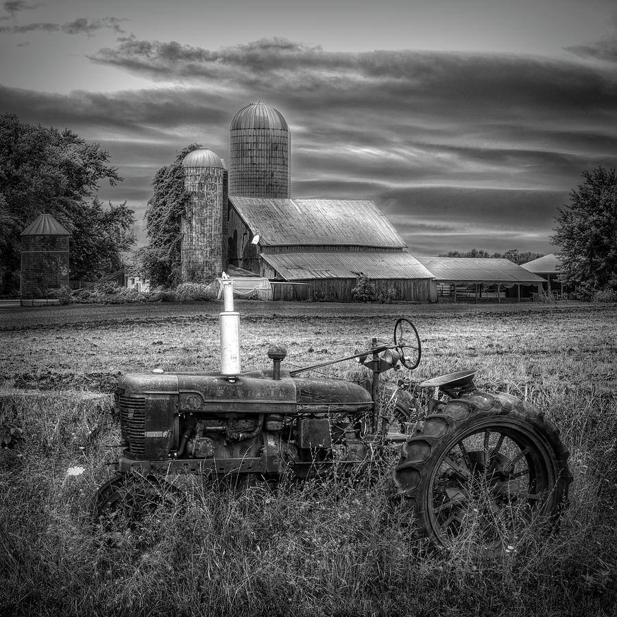 Vintage Tractor at the Country Farm in Black and White Photograph by Debra and Dave Vanderlaan