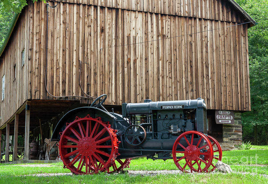 Vintage tractor on display outside a craft barn at Lost River, W Photograph by William Kuta