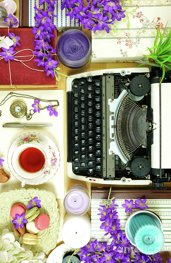 Vintage writers desk creative composition flat lay with typewriter and books. Photograph by Milleflore Images