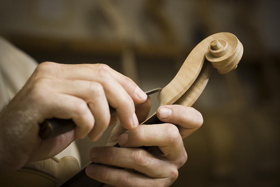 Violin Maker In The Workshop Photograph by RubberBall Productions