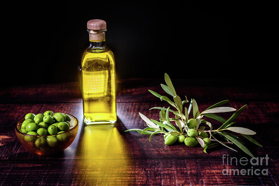 Virgin olive oil is extracted from green olives that grow in oli Photograph by Joaquin Corbalan