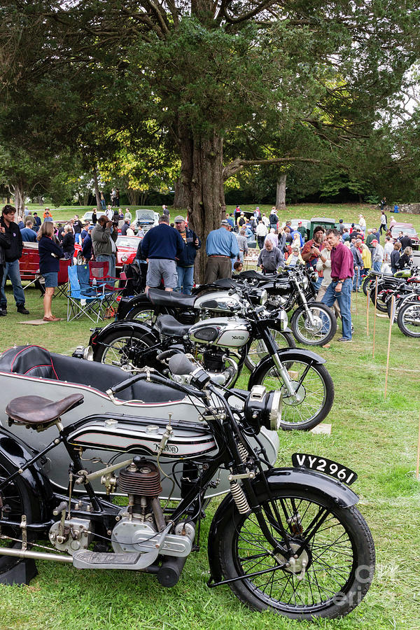 Visitors admire a row of Norton motorcycles at the 2014 Rockvill Photograph by William Kuta