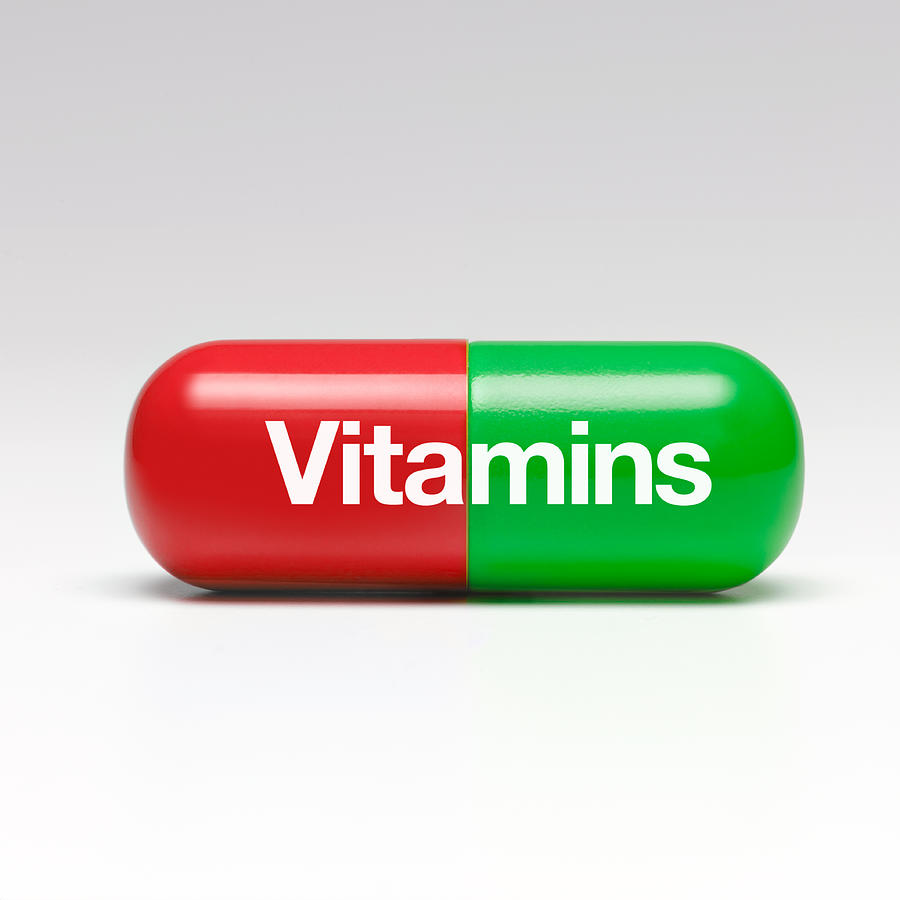 Vitamins capsule Photograph by Peter Dazeley