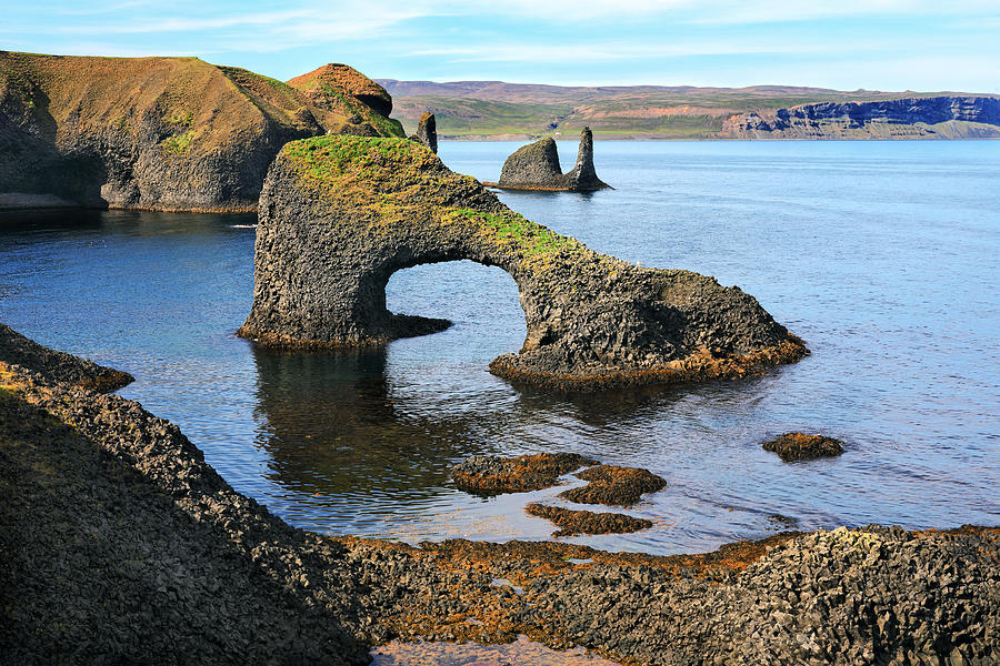 Volcanic arch on a rough coast of the Atlantic ocean in Iceland Photograph by Rainer Grosskopf