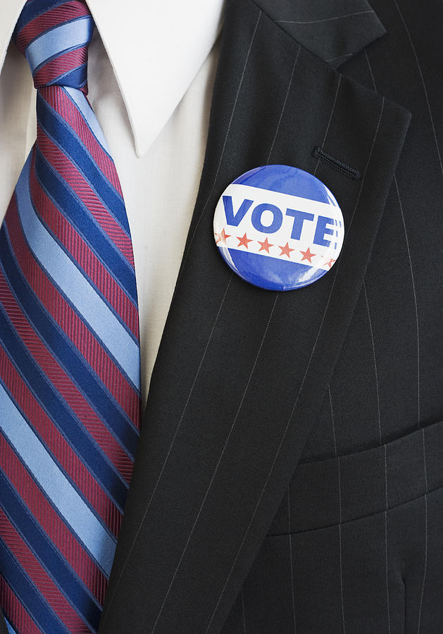 Vote pin on man?s lapel Photograph by Tetra Images