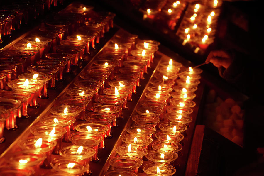 Votive candles in Notre Dame Photograph by Steve Estvanik