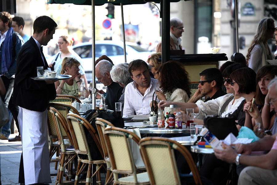 Waiter and diners at Les Deux Magots cafe in St-Germain-des-Pres. Photograph by Bruce Yuanyue Bi